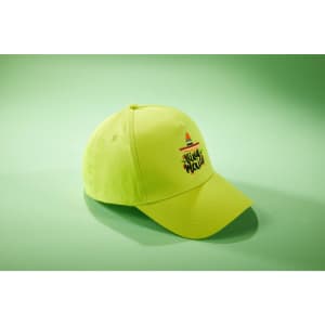 A bright yellow 5-panel cap with a branded logo on the front, displayed against a green backdrop.