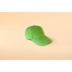A green 6 panel cap featuring soft lining, designed for casual headwear. It includes a logo on the front.
