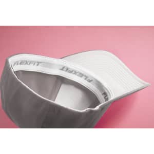 A white Original Flexfit® cap with an interior band featuring the brand name. The cap has a curved peak.