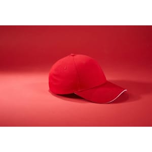 A red 6 panel brushed sandwich cap with a contrasting trim, featuring a logo on the front.