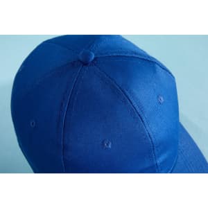 A blue 6-panel cap made of organic cotton, featuring a logo on the front.