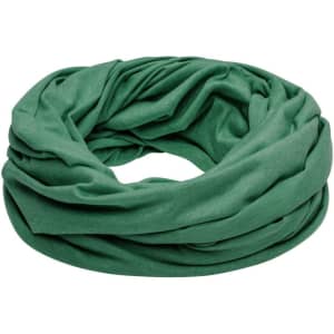 A green loop scarf made from soft fabric, elegantly draped and swirling in a circular shape.