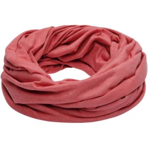 A loop scarf in a soft coral colour, featuring a gathered, textured design. The scarf has a logo printed on it.