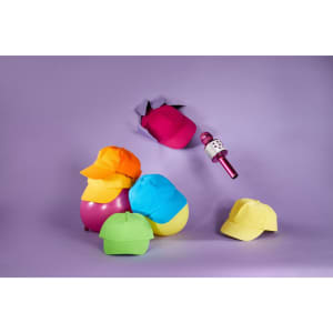 A colourful array of kids' caps in orange, yellow, pink, blue, and green, with a microphone suspended above them.