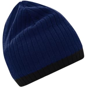 A knitted hat in navy blue with a black brim, featuring a logo on the side.