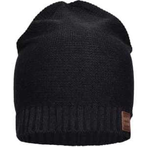 A black cotton beanie hat with a ribbed edge and a logo on the side.