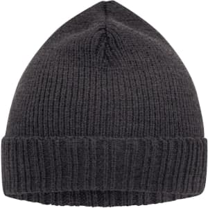 A dark grey knitted beanie featuring a ribbed design and a folded cuff. It has a logo on the side.