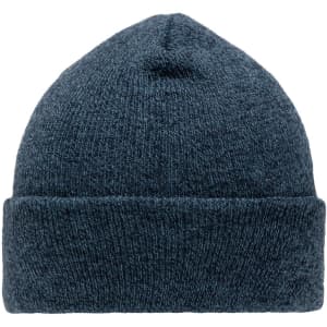 A navy beanie made from a textured knit fabric, featuring a folded cuff and a logo.