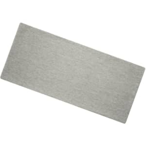 A grey Bio Cotton headband laid flat, featuring a simple design and a logo.