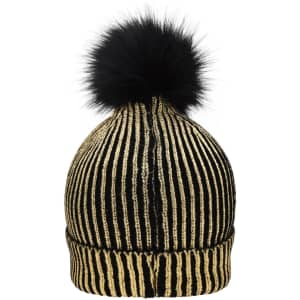 A metallic beanie in black and gold with a fluffy black pom-pom on top. It features a ribbed texture and a logo.