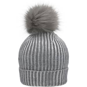 A grey metallic beanie with a fluffy pom-pom on top and ribbed texture. Features a logo.