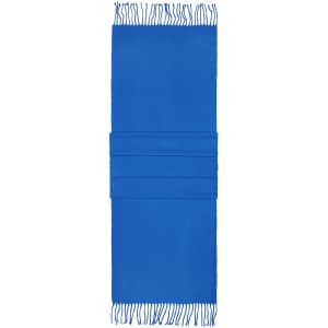 A blue elegant scarf with fringed edges and three textured folds at the centre. It features a logo on the fabric.
