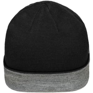 A reversible beanie featuring a black exterior and a grey cuff. The design includes a logo on the side.