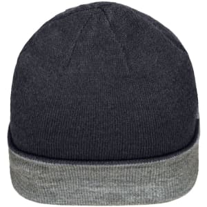 A reversible beanie in dark grey with a light grey cuff, featuring a logo on the side.
