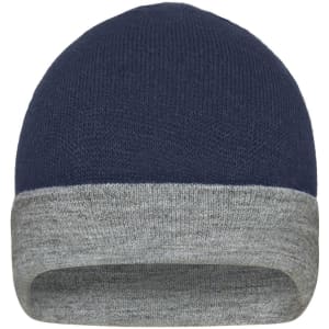 A reversible beanie in navy blue with a grey cuff, featuring a subtle logo on the surface.