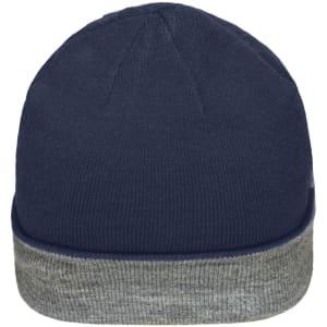 A reversible beanie featuring a navy blue exterior and a grey cuff, showcasing a simple and stylish design.