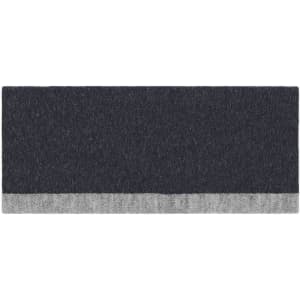 A reversible headband in dark grey with a light grey bottom edge, featuring a logo.