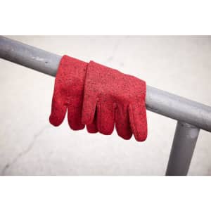 A pair of red fleece gloves resting on a metallic railing. The gloves have a textured, knitted appearance.