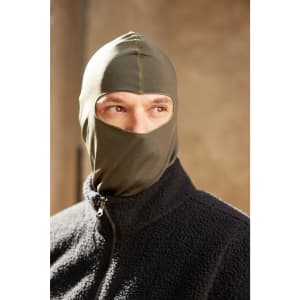 A green balaclava worn by a person, featuring a fitted design and a partial face cover.