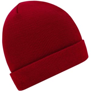 A red knitted beanie with a folded brim and ribbed texture, featuring a logo.