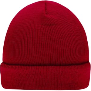 A red knitted beanie with a folded cuff and ribbed texture, featuring a logo on the side.