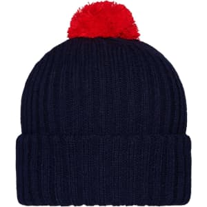 A navy knitted beanie with a bright red pompon on top. It features a ribbed design and a rolled cuff.