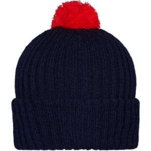 A knitted beanie in navy blue with a red pompon on top, featuring a ribbed design.
