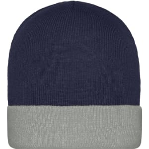 A knitted beanie in navy blue with a grey cuff, featuring a logo on the front.
