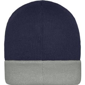 A knitted beanie in navy blue with a grey cuff, featuring a logo on the side.