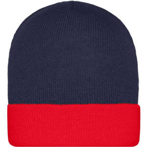 A knitted beanie featuring a navy blue top and a red folded cuff. The beanie has a logo on it.