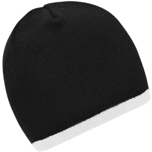 A beanie in black with a white contrast edge, featuring a simple knitted design and a logo on the side.