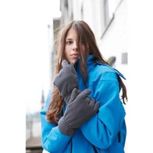 A woman wearing grey Thinsulate™ fleece gloves and a blue jacket, posing outdoors.
