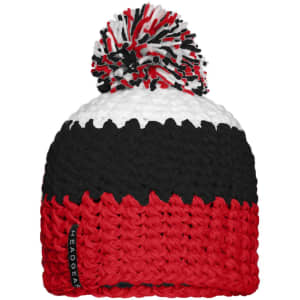 A beanie with a pompon featuring red, black, and white stripes, and a branding label on the side.