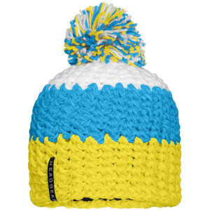 A beanie with a pompon featuring blue, white, and yellow crocheted patterns. It has a logo on the side.