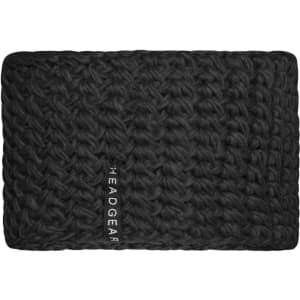 A black crocheted headband featuring a textured design and a logo.