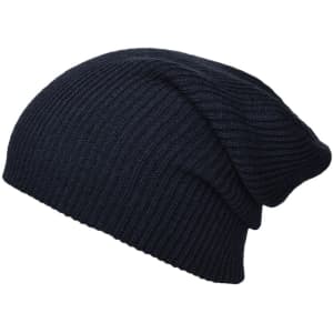 A knitted long beanie in dark navy, featuring a ribbed texture and a casual slouchy design.