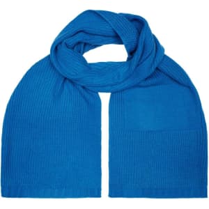 A blue knitted scarf with a textured finish, featuring a pocket on one side and a logo.