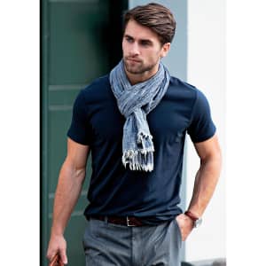 A navy Montauk Men T-Shirt worn with a light scarf and grey trousers, featuring a logo.