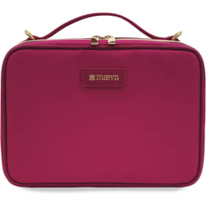 A fuchsia bag with a gold zipper and a logo, featuring a handle on top for easy carrying.
