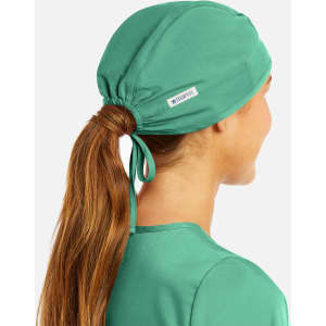 A unisex scrub cap in teal, featuring a logo, with a tie at the back for adjustable fit.