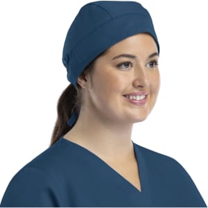 A unisex scrub cap in navy blue with buttons, designed for comfort and style. Features a smooth fabric texture.