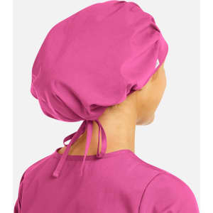 A unisex bouffant cap in vibrant pink, featuring a gathered design and adjustable ties at the back.