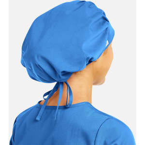 A unisex bouffant cap in bright blue with adjustable ties at the back, shown from the rear.