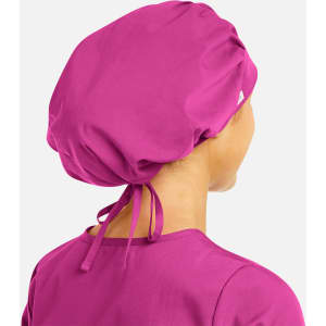 A unisex bouffant cap in a vibrant pink colour, featuring a drawstring tie at the back and a logo.