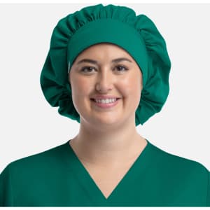 A unisex bouffant scrub cap in bright green, designed for uniform use, displayed on a smiling model.