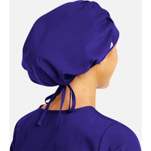 A unisex bouffant scrub cap in vibrant purple, featuring a logo and ties at the back.