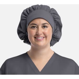 A grey bouffant cap worn by a smiling person, featuring a gathered design and a smooth band.
