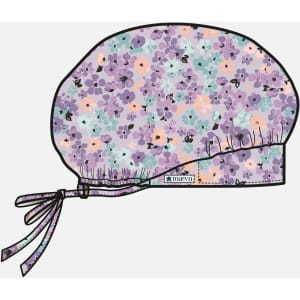 A printed unisex bouffant cap featuring a floral design in shades of purple, blue, and peach, with a tied ribbon.