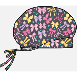 A printed unisex bouffant cap featuring a dark background with a pattern of colourful bows in pink, yellow, and purple.
