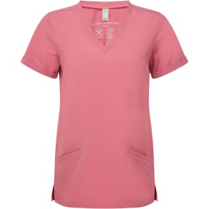A pink Women's Invincible Stretch Tunic with a V-neck design and two front pockets. It features a logo on the label.
